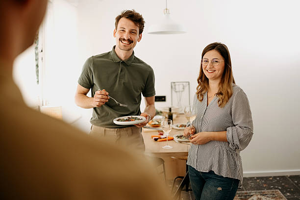 istock Friends have lunch together at home 2212239220