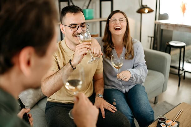 istock Friends drinking wine and playing guitar 2212239247