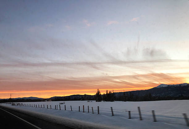 istock Sunset on the road from Brundage Mountain ski resort. View from car. 2212242914