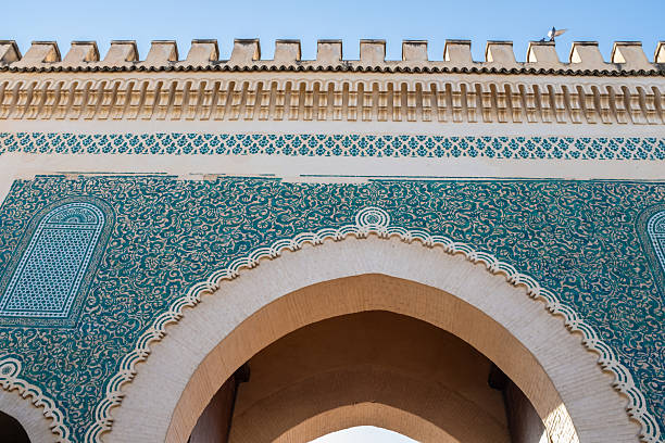 istock Beautiful old green wall gate door skyline in Fez, Morocco 2212244787
