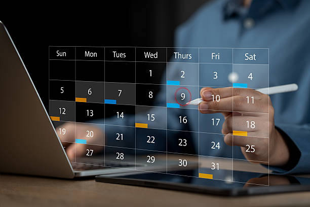 istock Businessmen use pen marks on the virtual screen calendar, Time management and scheduling concept. Business Planning Calendar Agenda work schedule, plan, goal, calendar 2212245385