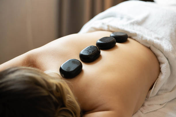 istock Healing Touch with Hot Stones Therapy 2212248437