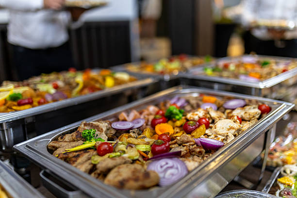 istock Catering buffet with assorted grilled meats and vegetables served at an evening event 2212252053