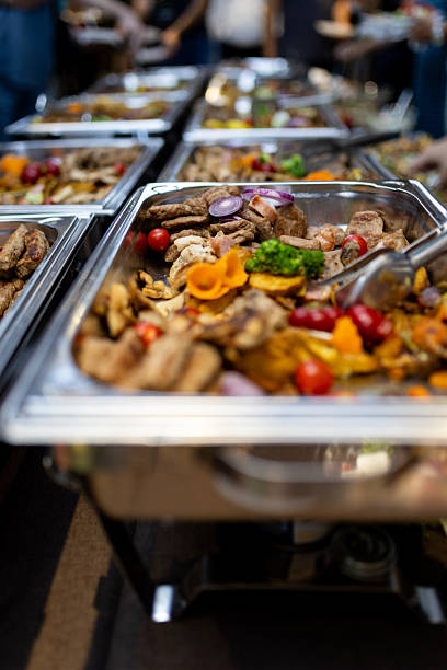 istock Assorted dishes served at a buffet during a festive gathering with guests enjoying the meal 2212252063