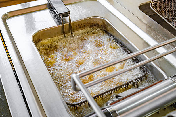 istock boiling oil in deep fryer close-up 2212254735