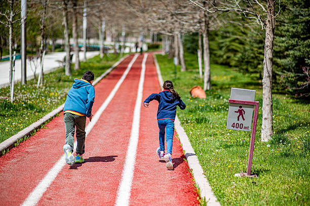 Brothers running 400m in the running park