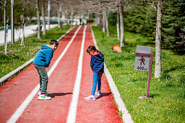 Brothers preparing to run 400m at the running park