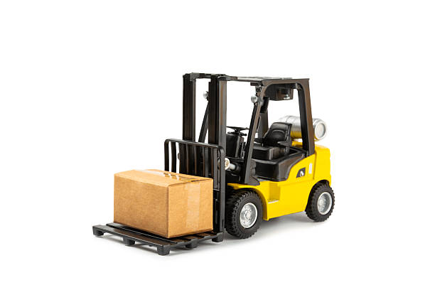 istock Yellow forklift isolated on white background. Logistics concept. Logistics and supply chain management for online shopping concept. Delivery of goods or products to the store worldwide. Cardboard box. 2212263940