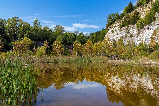 istock Scenic view of a bluff reflected in a pond 2212264921