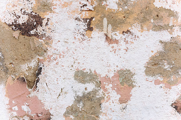istock Unique textured wall with peeling paint exhibiting natural color variations and patterns 2212265570