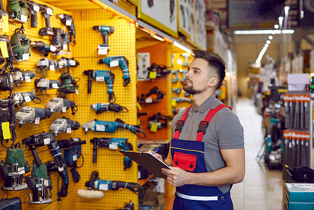istock Salesman who works at a DIY store or shopping mall is checking construction tools 2212271949