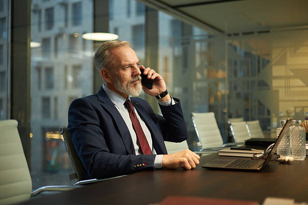 istock Male CEO in Suit Talking on Phone 2212272658