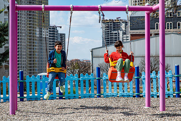 Children on swings in playground
