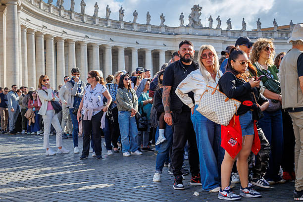 The crowd of faithful in St. Peter's Square, for the last respects to the body of Pope Francis. stock photo