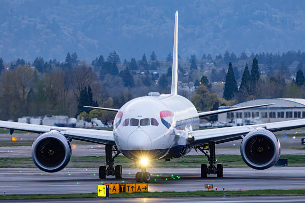 Portland, Oregon, USA - April 1, 2025: A British Airways Boeing 787 taxies out to the runway at Portland International Airport.