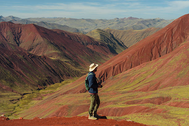 istock Man hiking in Peruvian Andes near Rainbow mountains 2212291953