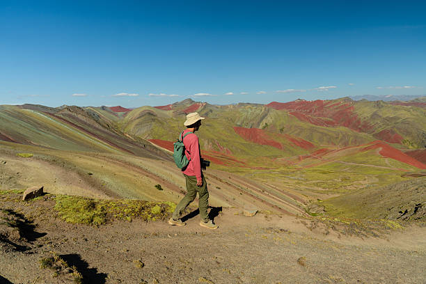 istock Man hiking in Peruvian Andes near Rainbow mountains 2212291984
