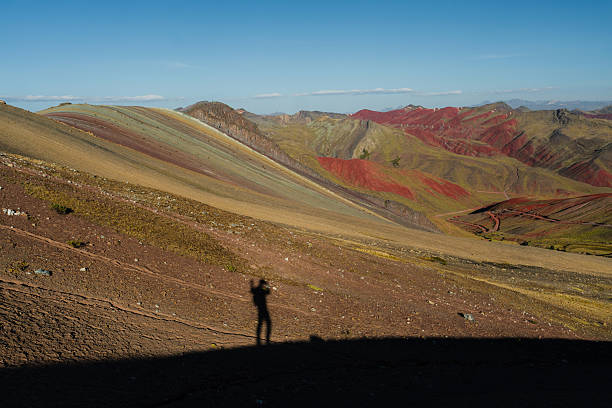 istock Shadow of hiker at Rainbow Mountains in Peru 2212292205
