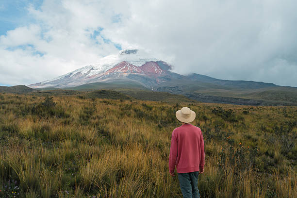 Man exploring scenic paramo at Cotopaxi National Park in Ecuador  during experiential trip in remote location