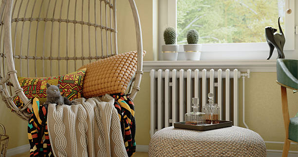 istock Cozy Egg Chair with Knit Throw and Tribal Pillow 2212304969