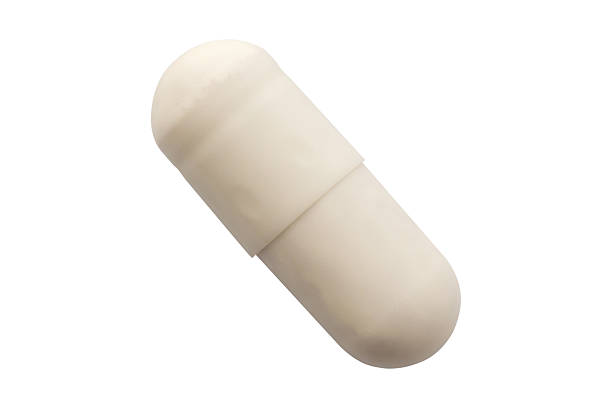 istock White medicine pill capsule isolated on white background 2212305311