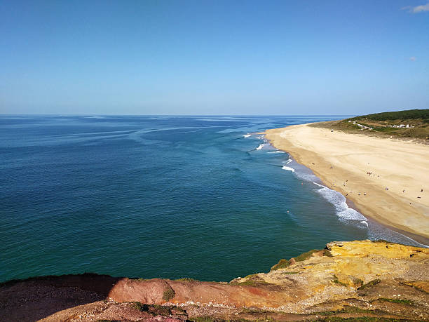 istock Scenic ocean view from cliffside, featuring a beautiful beach. Ideal for travel, vacation, or nature themes. Evokes a sense of peace and tranquility. 2212305890