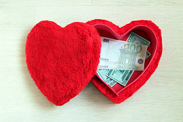 istock Euro and American Dollar Banknotes in red box. 2212308424