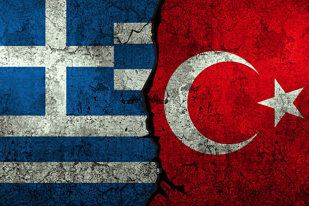 istock Greece vs Turkey conflict concept background with flag painted on the wall 2212312058