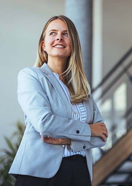 istock Confident Businesswoman in a Bright Office Environment 2212312096