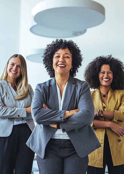 istock Confident Businesswomen Smiling in a Modern Office Environment Together 2212312101