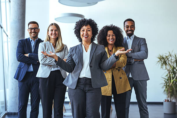 istock Diverse Professional Team Smiling in Modern Office Environment 2212312109