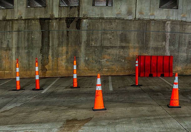 istock Traffic cones set out in a parking garage 2212312445