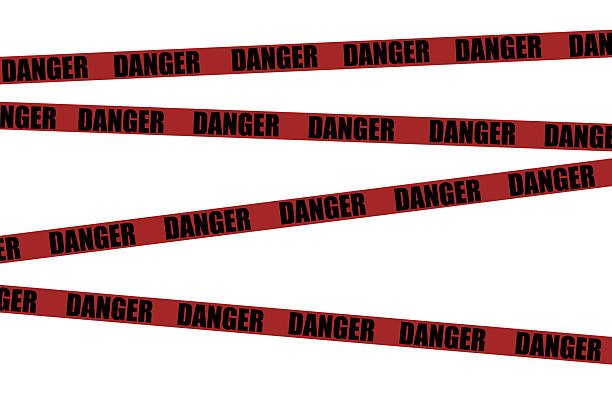 istock Danger tape. Red tape with black text danger do not enter for industrial safety, road, construction, hazard area 2212312447
