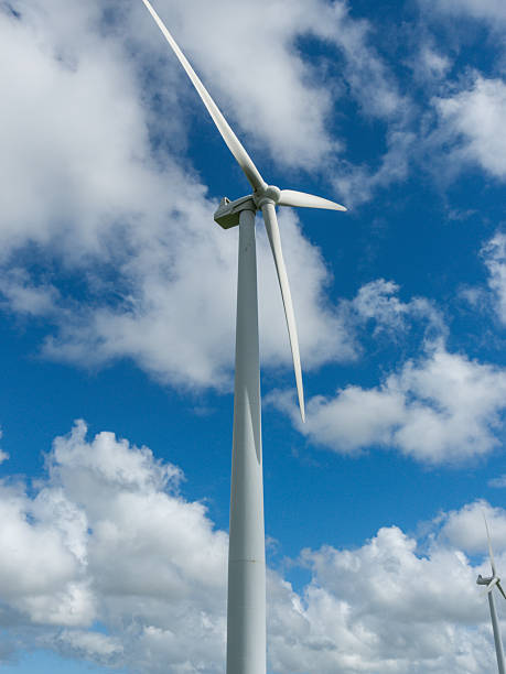 istock White wind turbines over rural hills 2212313219