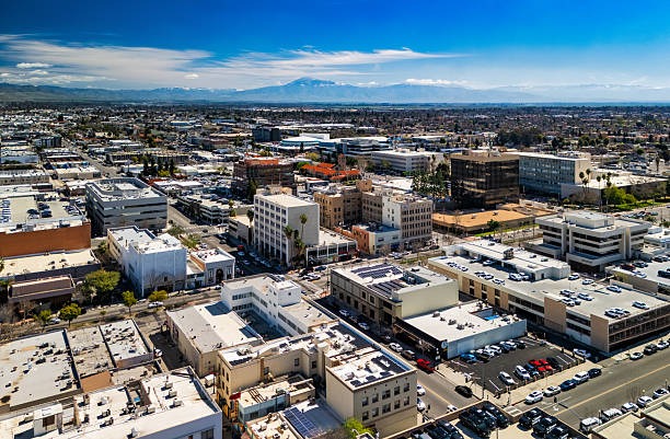 Downtown Bakersfield aerial with the Sierra Nevada Mountains in the far distance.