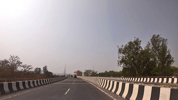 istock Road Disappearing into Horizon 2212321532