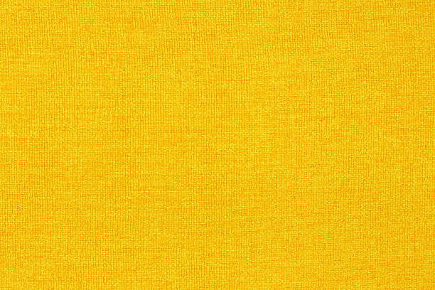 istock Yellow golden fabric cloth texture background, seamless pattern of natural textile. 2212322472