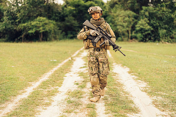 Even when alone, the soldier remains connected to his team via secure communications equipment, ready to relay intelligence or call for help if the situation escalates.