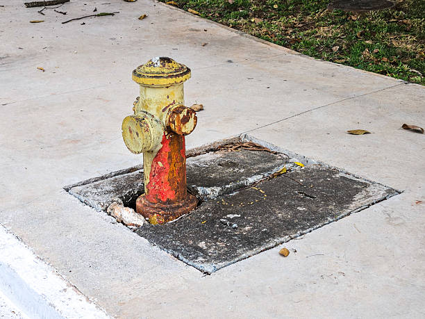 County Field Technician bleeding a fire hydrant to clear out non-potable water.