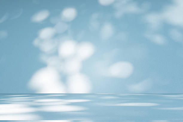 istock Studio style background wall decoration presentation uses white and blue tones. with shadows cast from a nearby window, concept creating a decorative 2212325233