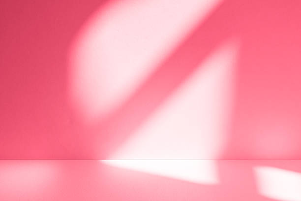 istock Wall interior background, studio, and backdrops show products. with shadow from window color white and pink light. background for text insertion and presentation of product 2212325235