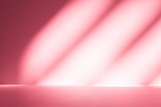 istock Wall interior background, studio, and backdrops show products. with shadow from window color white and pink light. background for text insertion and presentation of product 2212325242