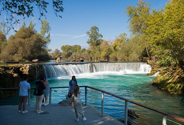 Manavgat, Antalya, Turkey - 10.24.2024: Tourists at the Manavgat waterfall. Tourism symbols of Antalya.