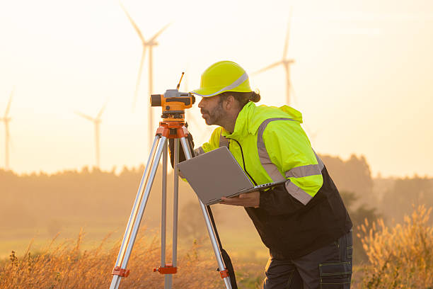 istock Engineer working on laptop checking wind turbines of the field. 2212328449
