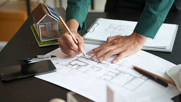 istock Architecture Man drawing on architectural Creative project business architecture building constructionÂ Industrial engineering Achievement Planning Design on eco blueprint 2212330105