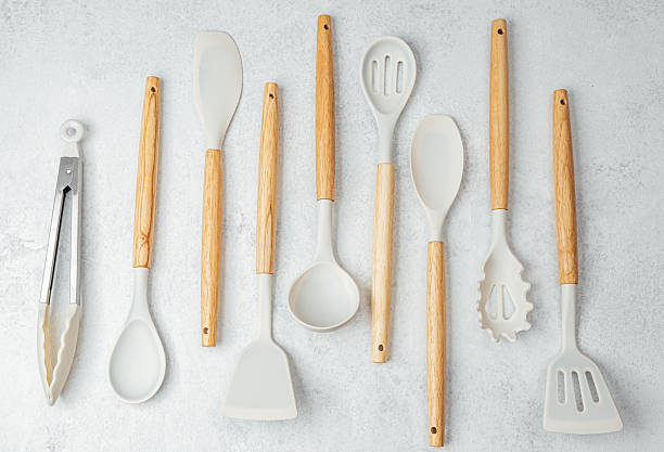 istock Kitchen utensils arranged neatly on a light countertop for cooking preparation 2212334499