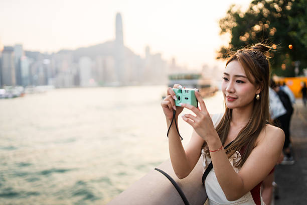 Moments worth capturing, woman captures beauty using her camera.