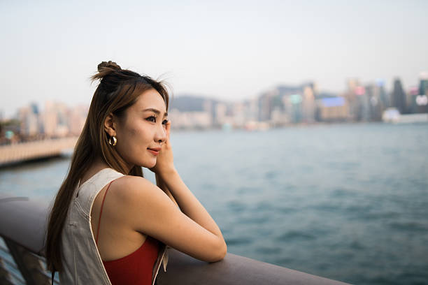 istock Woman looking at city view. 2212335008