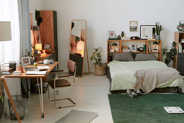 istock Organized Modern Bedroom with Home Office Space 2212335140