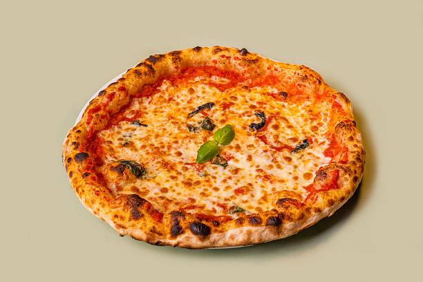 istock Traditional margherita pizza with melted mozzarella, tomato sauce and fresh basil. 2212335784